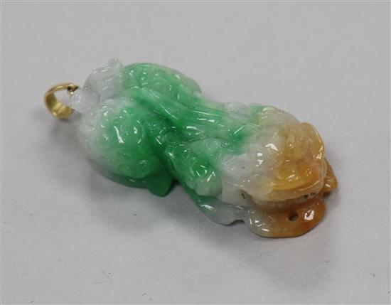 A three colour jade carved pendant, 41mm.